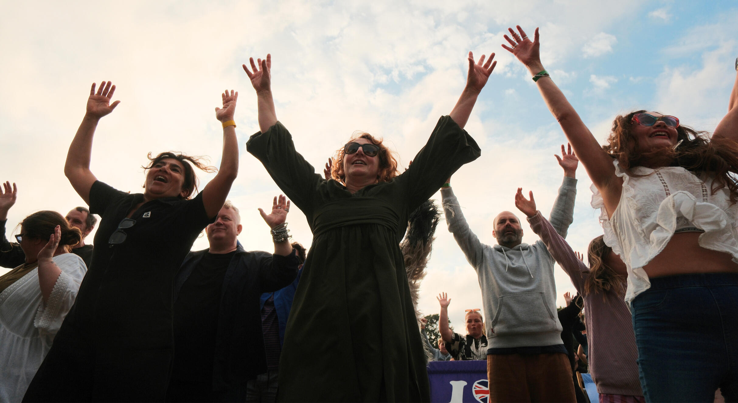 Audience with arms in the air